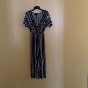 Navy Blue and white jumpsuit with low V neck cut.